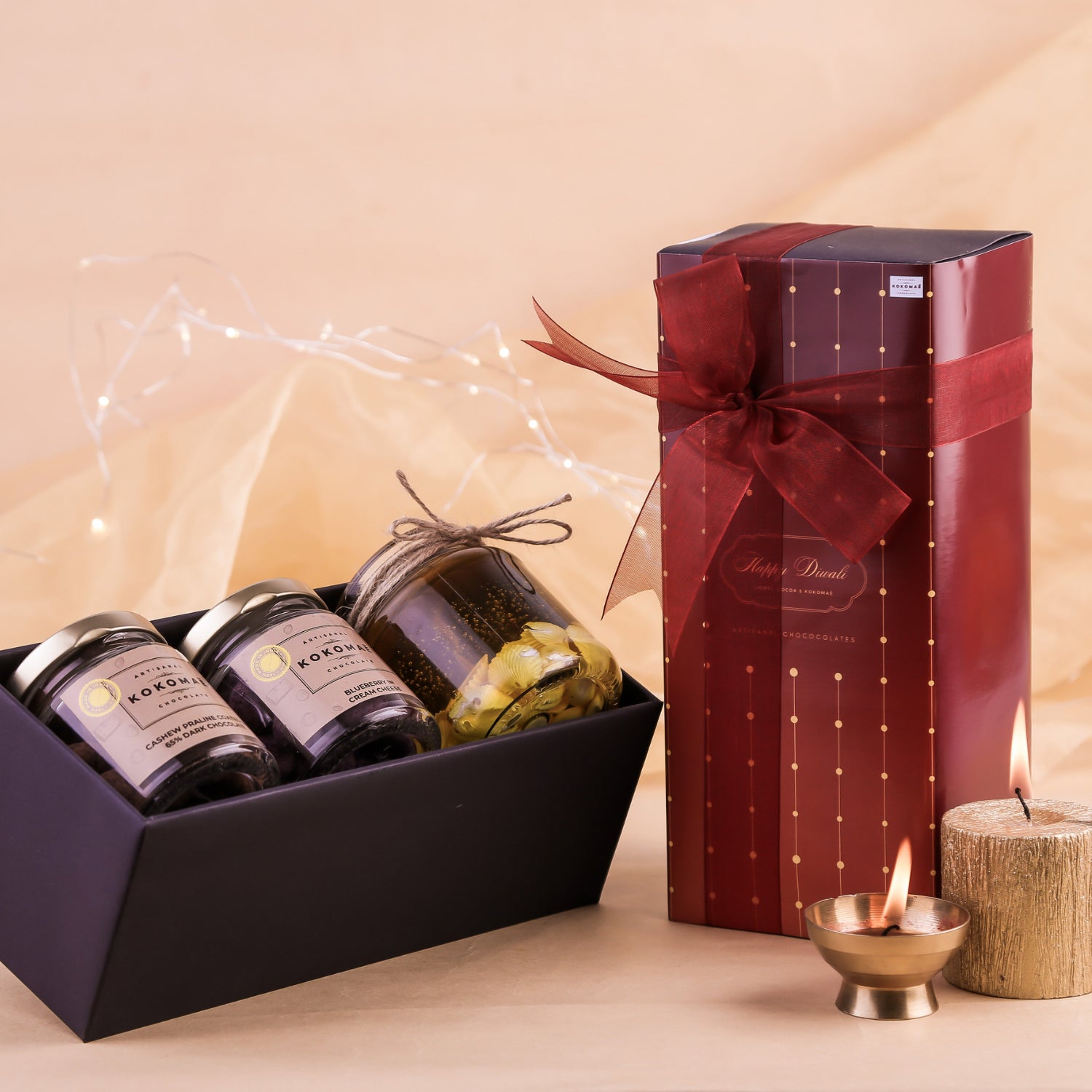 Kokomaē Handcrafted Diwali Gift with 2 Jars of Chocolate Coated Nuts & a Jar Candle
