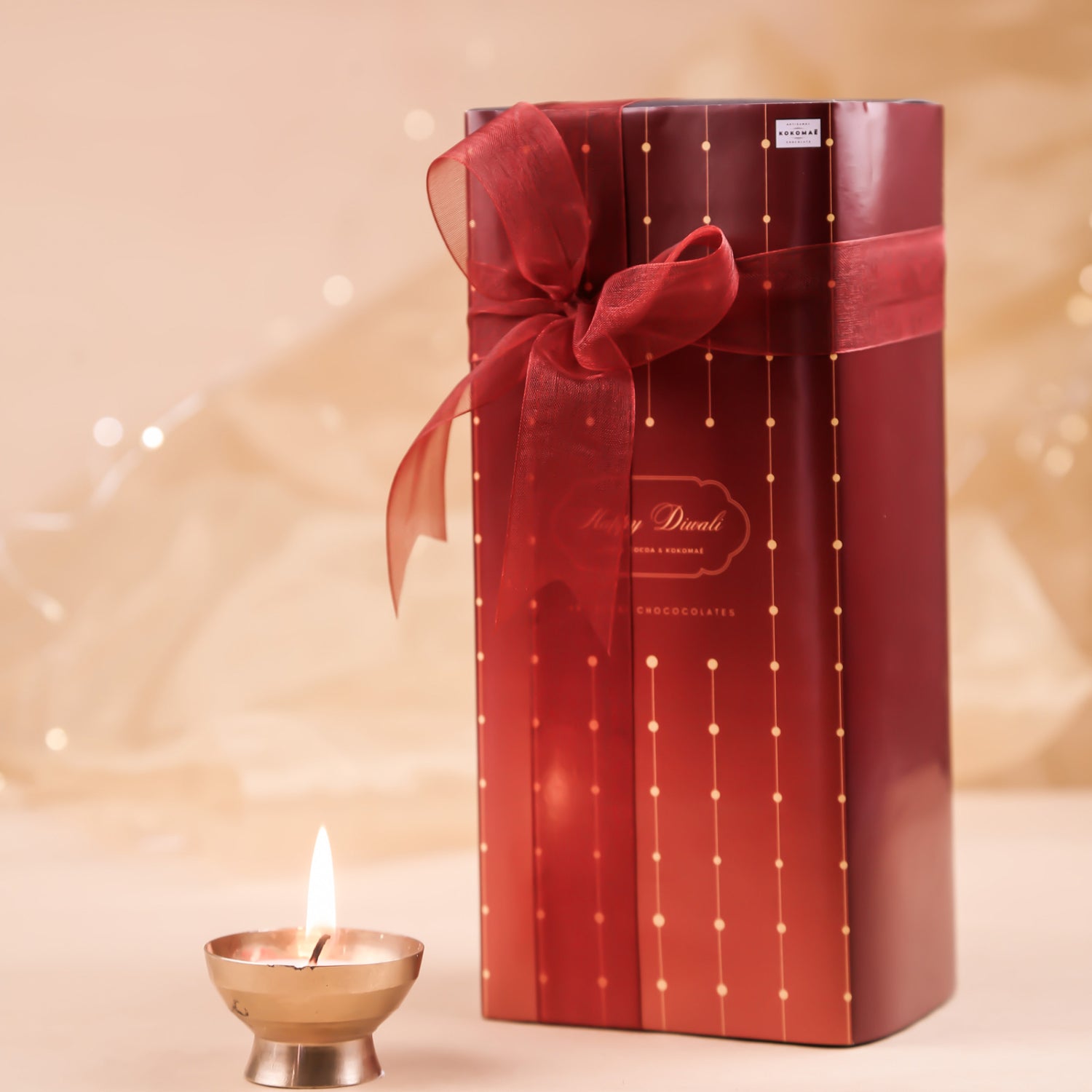 Kokomaē Handcrafted Diwali Gift with 2 Jars of Chocolate Coated Nuts & a Jar Candle